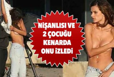 Üstsüz poz verdi, çocukları kenarda izledi